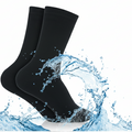 Black socks with water splashes on a light blue background, labeled 'WUDHU SOCKS'.