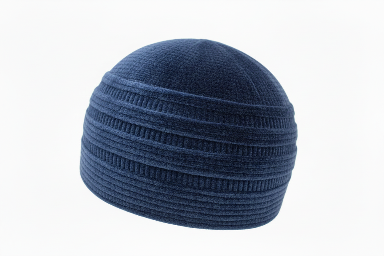 Blue knit beanie on a white background