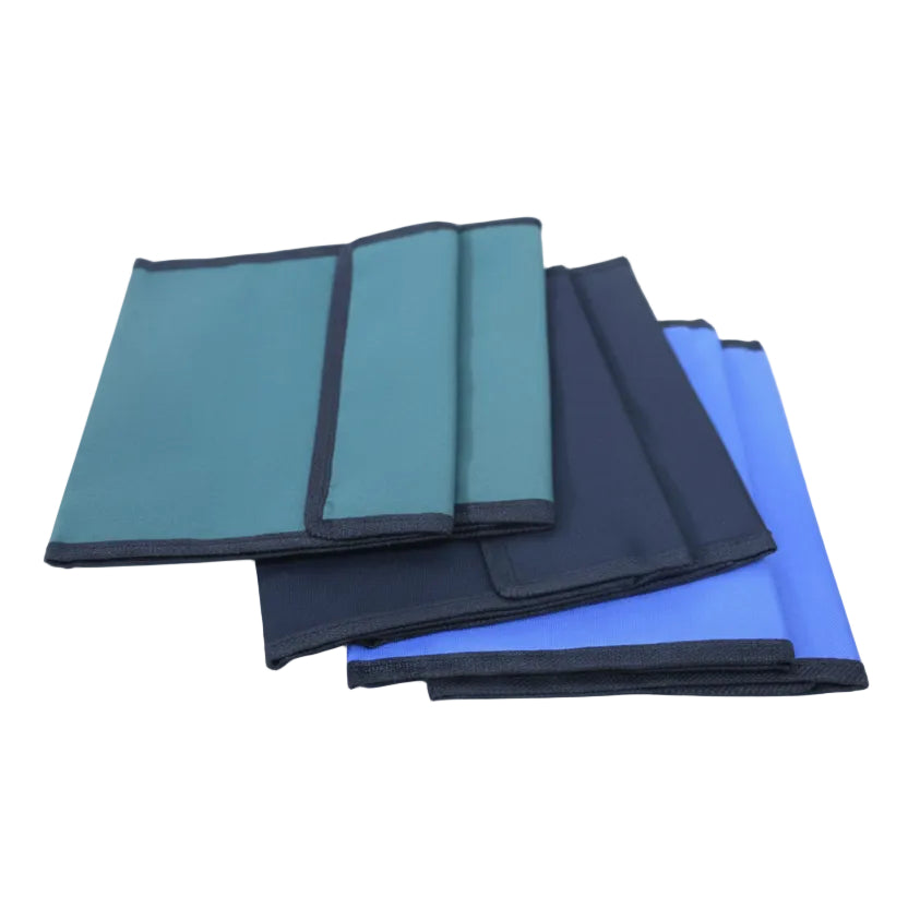 Set of folded blue and black cloths on a white background