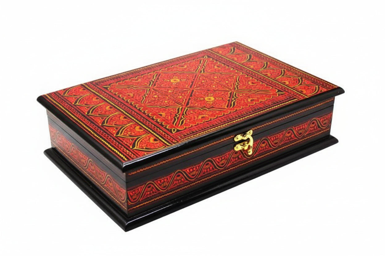 A handmade wooden lacquer art Quran box with a vibrant red and black traditional design, featuring a geometric pattern and gold accents.